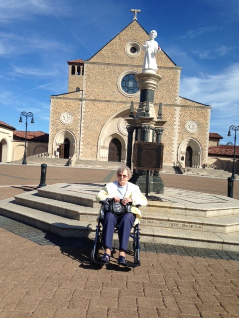 Irene Dobelmann sitting in front of church